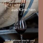 Rotwein wird aus großer Glaspipette in Weinglas gegossen